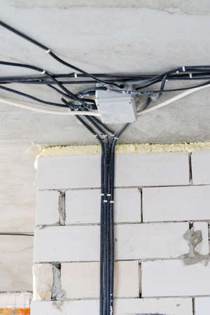 Manufacture of electrical wiring in a brick house. Manufacture of electrical wiring in a brick house.の写真素材
