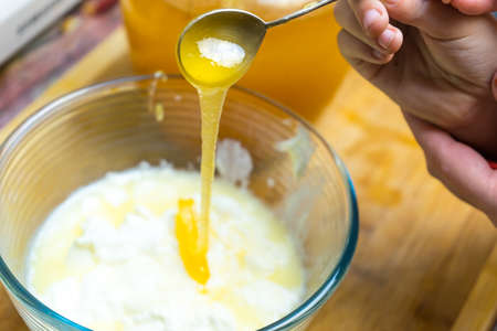 Preparation of baking dough using honey. The sweet kitchen. Preparation of baking dough using honey. The sweet kitchen.の写真素材