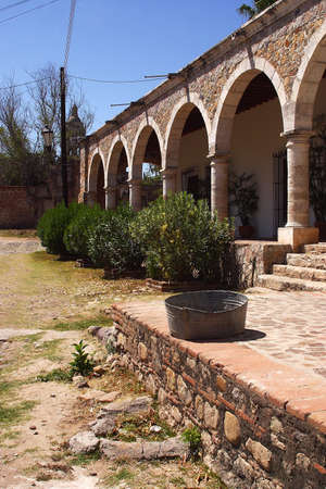 detail of the wall of a colonial house and part of the inside patio in the town of Alamos in the northern state of Sonora, Mexico, Latin Americaの写真素材