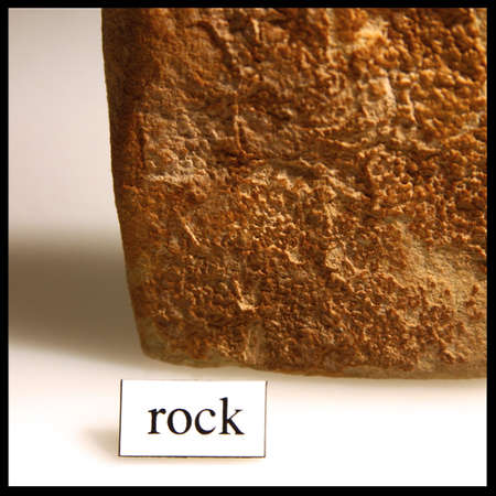 detail of a piece of a rock with the written word detailing itの写真素材