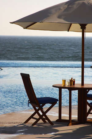 evening drink and relax moment next to the pool a hotel in Puerto Vallarta, Jalisco, Mexico, Latin Americaの写真素材