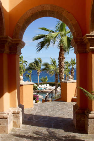 partial view from an archway of the pools of a hotel at Los Cabos, Baja California, Mexico, Latin Americaの写真素材