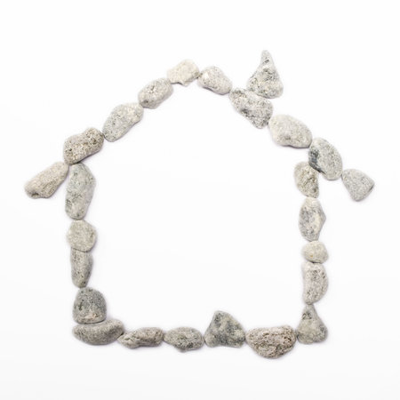 house symbol create with small rocks of a river