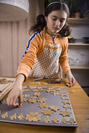 Cooking homemade cookies in Christmas evenの写真素材