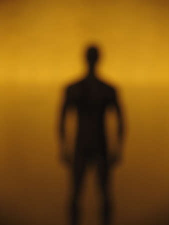 silhouette of a man against a colored backgroundの写真素材