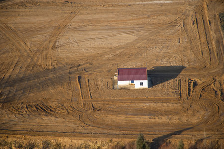 house surrounded by nothing in the fieldの写真素材