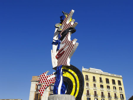 El Cap de Barcelona or The head of Barcelona, a colourful, Surrealism like 20 meters high Pop-Art construction from Roy Lichtenstein (1923-1997). The late American pop artist Roy Lichtenstein created a colourful portrait of a womanÂ´s face in the cartooniのeditorial素材