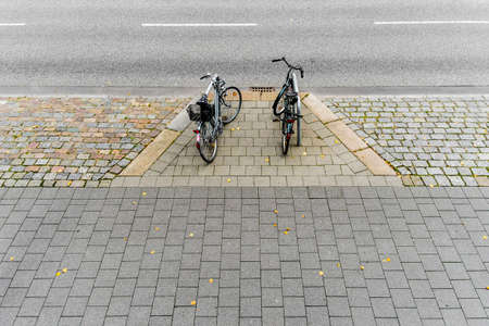 Bicycles on roadside in Hamburg, Germanyの写真素材