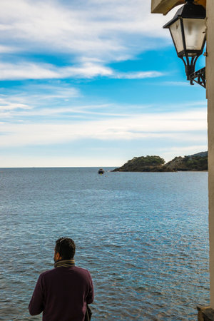 A man in the coast of Cadaques, Catalonia, Spainの写真素材