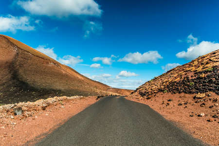 Road in the volcanic area of Lanzarote, Canary Islands, Spainの写真素材