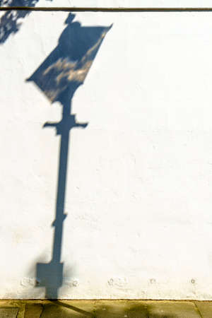 Public lamp shadow in a street of London United Kingdomの写真素材