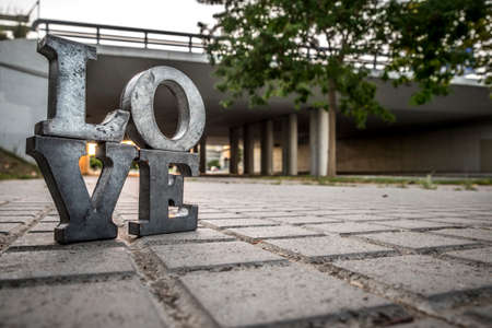 Love sign with metal letters in a street of Spainの写真素材