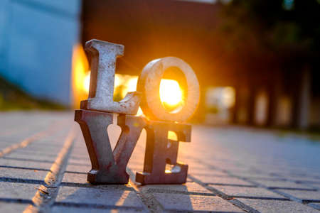 Love sign with metal letters in a street of Spainの写真素材