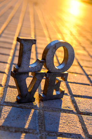 Love sign with metal letters in a street of Spainの写真素材