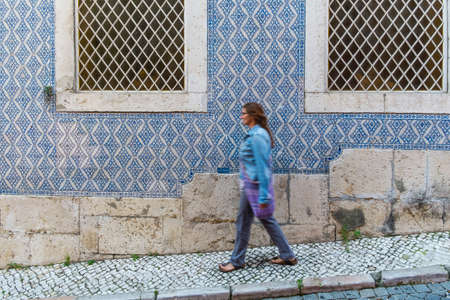 Lisbon, Portugal - April 16, 2014:Woman walking in Lisbon Portugalのeditorial素材