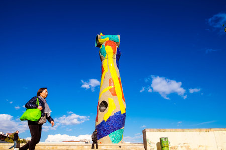 Barcelona, Spain - February 14, 2016:  Statue 'Woman and Bird' (Dona i Ocell, in catalan), created by Joan Miro in Joan Miro squareのeditorial素材