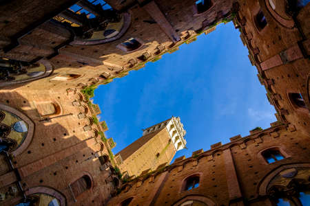 Piazza del Campo is the main square of Siena with view on Palazzo Pubblico and its Torre del Mangiaの写真素材