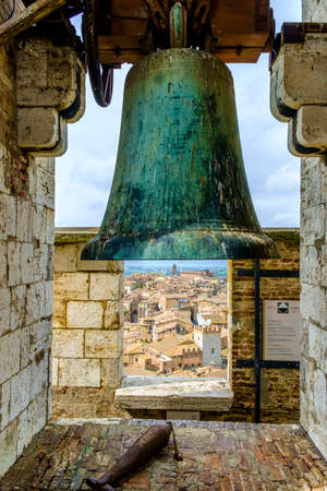 Bell at the top of Torre del Mangia in Palazzo Pubblico Siena Tuscany Italyのeditorial素材