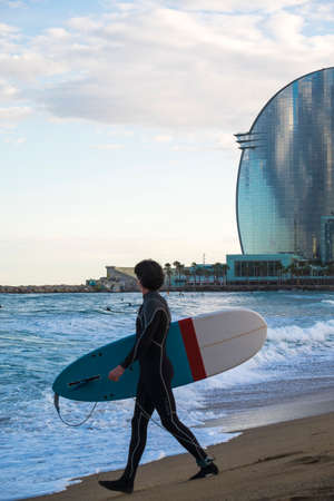 Barcelona, Spain - March 3, 2016: 
surfing in the popular beach of Barceloneta in the coast of the capital of Cataloniaのeditorial素材