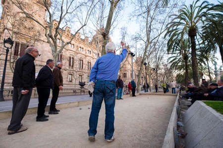 Barcelona, Spain - February 20, 2017: old people playing the traditional petancaのeditorial素材