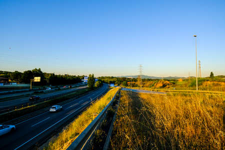 Sant Cugat del Valles, Barcelona, Spain - June 19, 2018: The new government of the Spanish PSOE has announced that some sections of the AP-7 highway will no longer be toll. In the photo the highway as it passes through the Catalan city of Sant Cugat del Vのeditorial素材