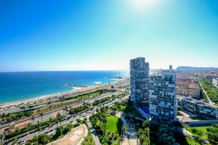 Aerial view of the Mediterranean beaches and modern buildings of Barcelona in the area of Diagonal...