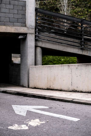 traffic sign with an arrow in a streetの写真素材