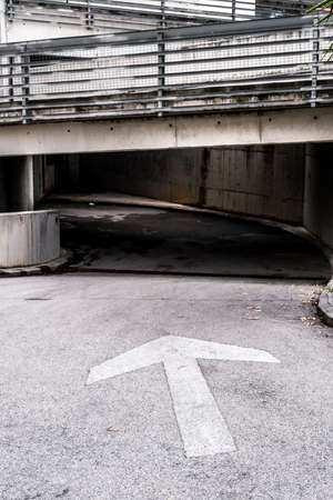 traffic sign with an arrow in a streetの写真素材
