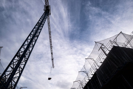 Silhouette of construction crane on apartment buildings in Sant Cugat del Valles in the province of...