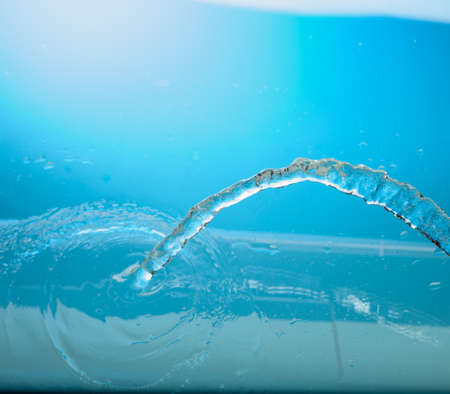 Water stream on a blue backgroundの写真素材