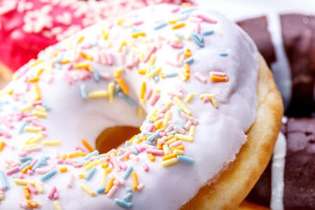 Delicious donuts with sprinkles closeupの写真素材