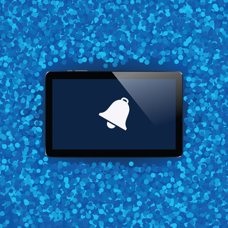 Digital tablet with shiny sensor screen on holiday event confetti spray background. Electronic smart...