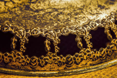 Antique rustic bronze element with floral and rose frames. Close up vintage metal decorative reliefの写真素材