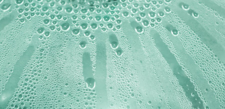 Water drops at gradient background. Glass covered with water drops condensation