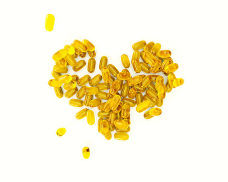 Fish Oil Capsules for health. Omega-3 and vitamin capsules isolated on white background. Healthy lifestyle conceptの写真素材