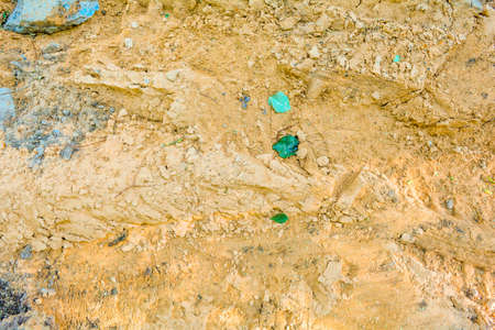 Close-up of ground with dirt and sand soil in random with small stones. Randomly sketched dirty loose coarse sand interspersed with debris and small gravelの写真素材
