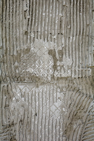 Rusty concrete surface with striped relief. Texture with engraved lines on urban cement wall. Txture...
