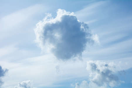 Blue sky with white cirrus and fluffy cumulus clouds. Blue and white heavenの写真素材