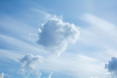 Blue sky with white cirrus and fluffy cumulus clouds. Blue and white heavenの写真素材
