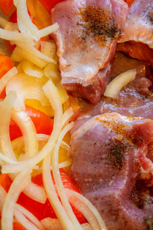 Fresh raw chicken meat pieces. Ready to cook turkey meat with cutting vegetable. Cooking backgroundの写真素材