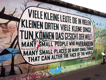 BERLIN GERMANY  SEPTEMBER 22: Graffiti on Berlin Wall at East Side Gallery on September 22 2014 in Berlin. Famous 1.3km long memorial of the original wall.のeditorial素材