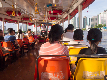BANGKOK, THAILAND - JANUARY 29 : Thai people passengers and foreigner travelers sit on boat at Chao Phraya river at Bangkok in January, 2017 at Bangkok, Thailandのeditorial素材