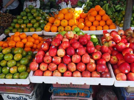 Apples and other fruits display on the market stand.の写真素材