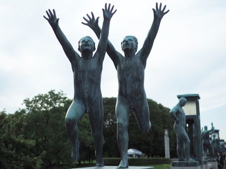 Oslo, Norway - August 27, 2017: Two Boys Running with Arms towards the Sky at Vigeland Park in Oslo, Norway, sculpted in bronze by Gustav Vigeland.のeditorial素材