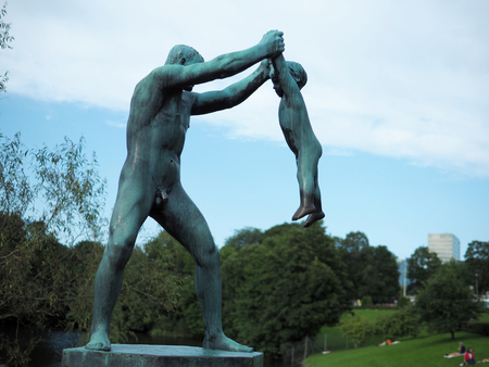 Oslo, Norway - August 27, 2017: 'Man Swinging Boy' at Vigeland Park in Oslo, Norway, sculpted in bronze by Gustav Vigeland.のeditorial素材