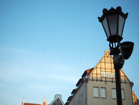 Vintage Lamp post with blue sky in old town, Gdansk, Poland.の写真素材