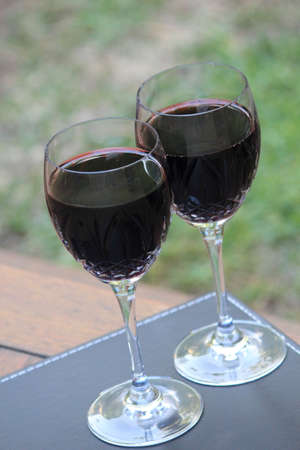 red wine in the gardenの写真素材