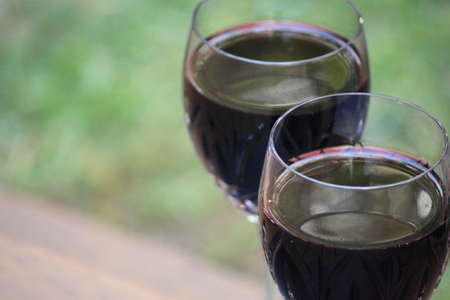 red wine in the gardenの写真素材