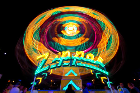 Carnival Ride "The Zipper" shown in night time at the Midland County Fair in Midland Michiganの写真素材