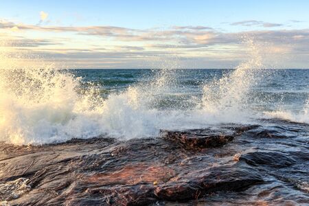 Storm surge drives crashing waves over sandstone rock at Pictured Rocks National Lakeshore in the Upper Peninsula of Michigan, in Munisingの写真素材